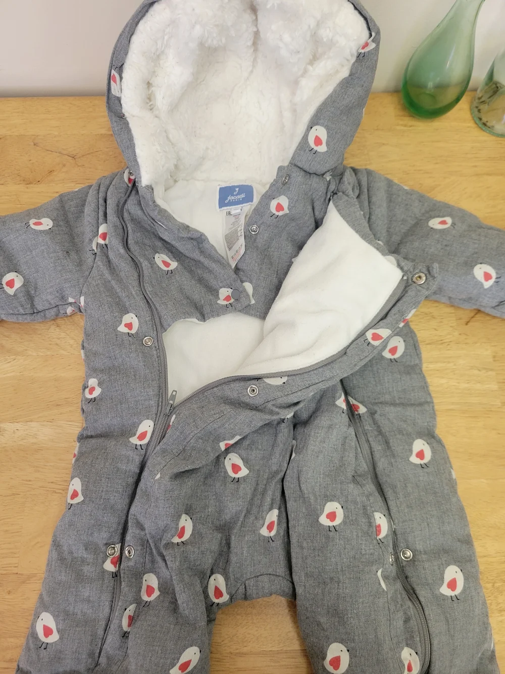 Gray Jacadi Paris infant snowsuit featuring a red and white bird pattern 12m